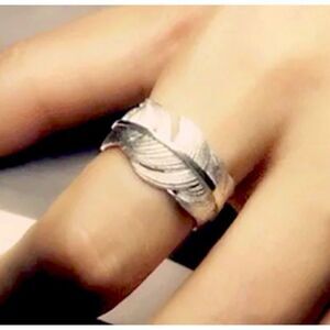 The Flirty Feather adjustable sterling silver ring.